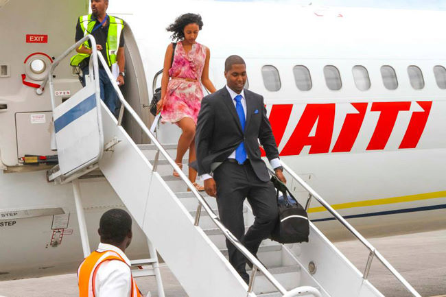Passengers step off of a Haiti Aviation air plane